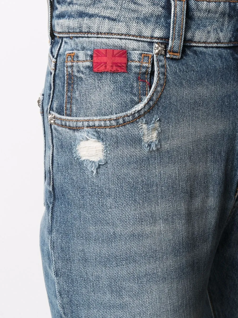 фото John richmond джинсы кроя слим с эффектом потертости