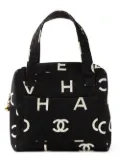 CHANEL Pre-Owned logo print canvas handbag - Black