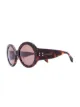Imagen 2 de Alexander McQueen Eyewear gafas de sol con montura redonda y apliques