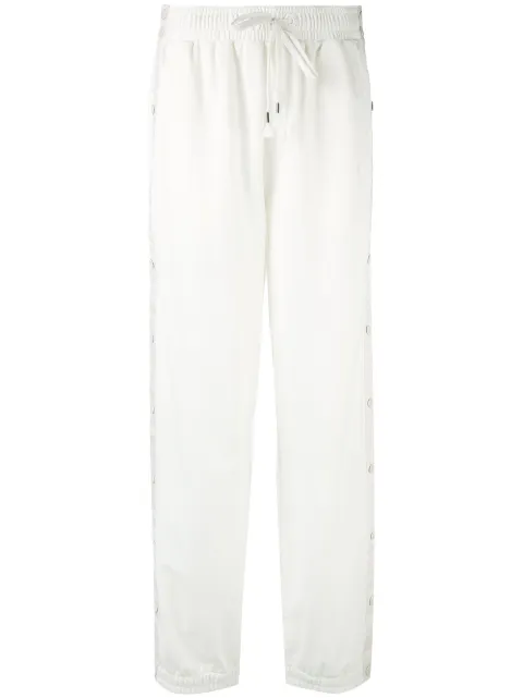 PUMA pants con botones laterales