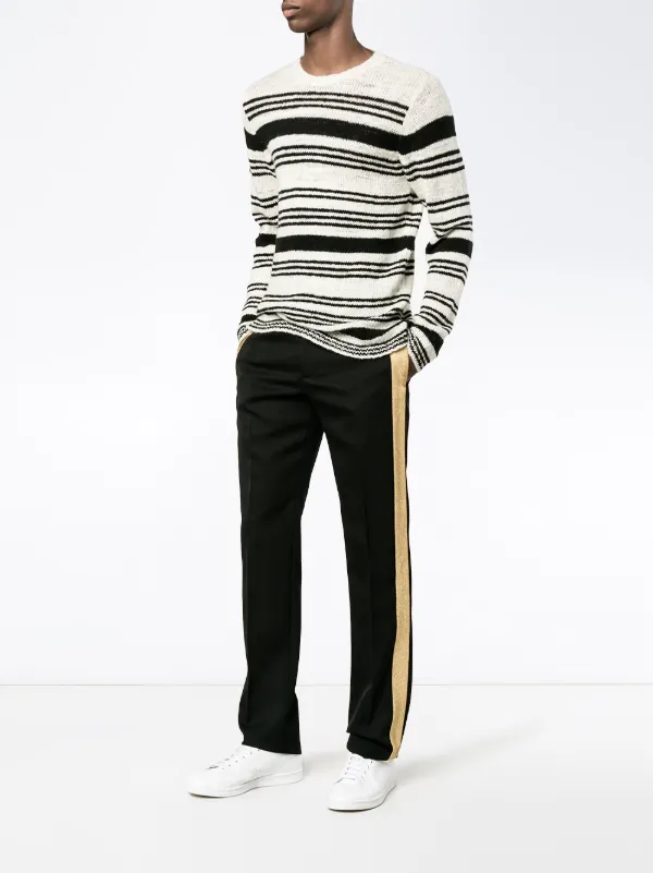 black trousers with gold stripe