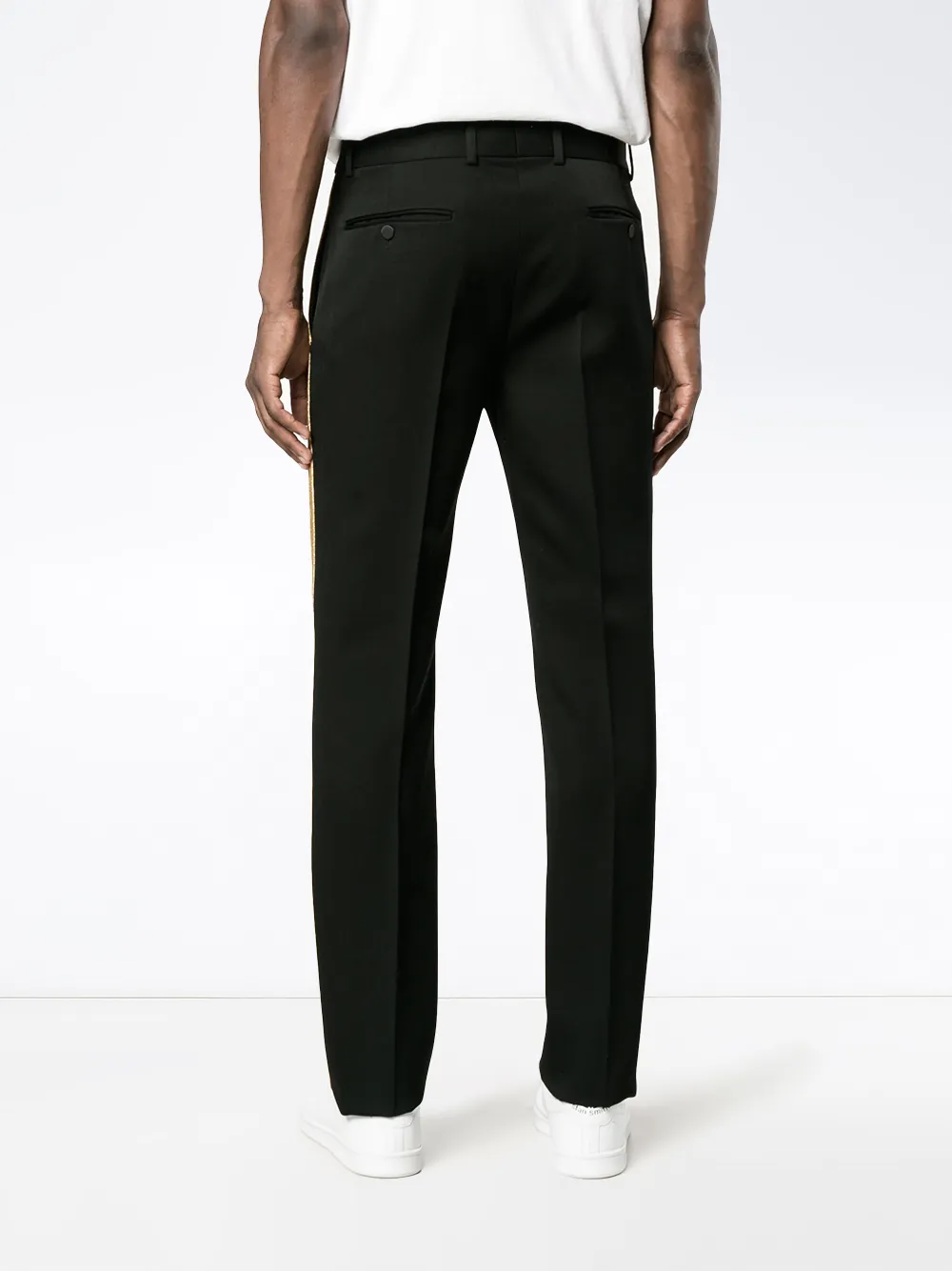 black trousers with gold stripe