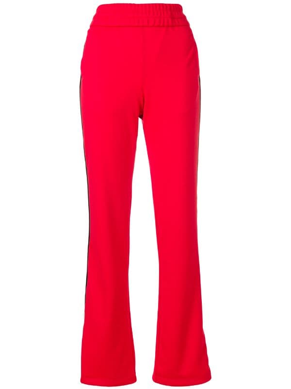 red track pants with white stripe