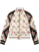 الصورة 1 من Gucci جاكيت بومبر حرير بطبعة ورد