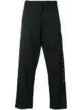 Black Comme Des Garçons studded chinos