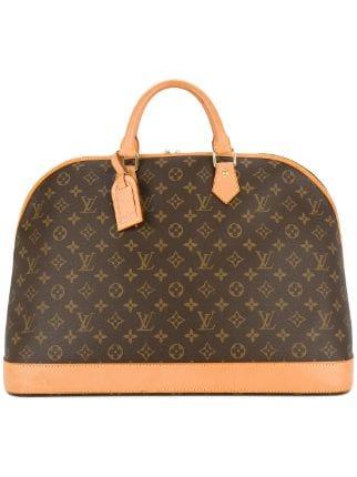 LOUIS VUITTON. Alma handbag in monogrammed leather and b…