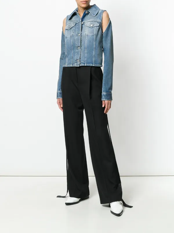 cutting a denim jacket