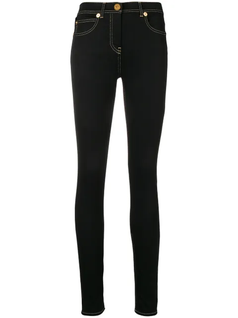 Click to view more detailed imagery on our partner's website Versace Logo Stripe Skinny Jeans In Black