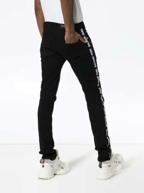 Shop black Balmain slim leg logo stripe 