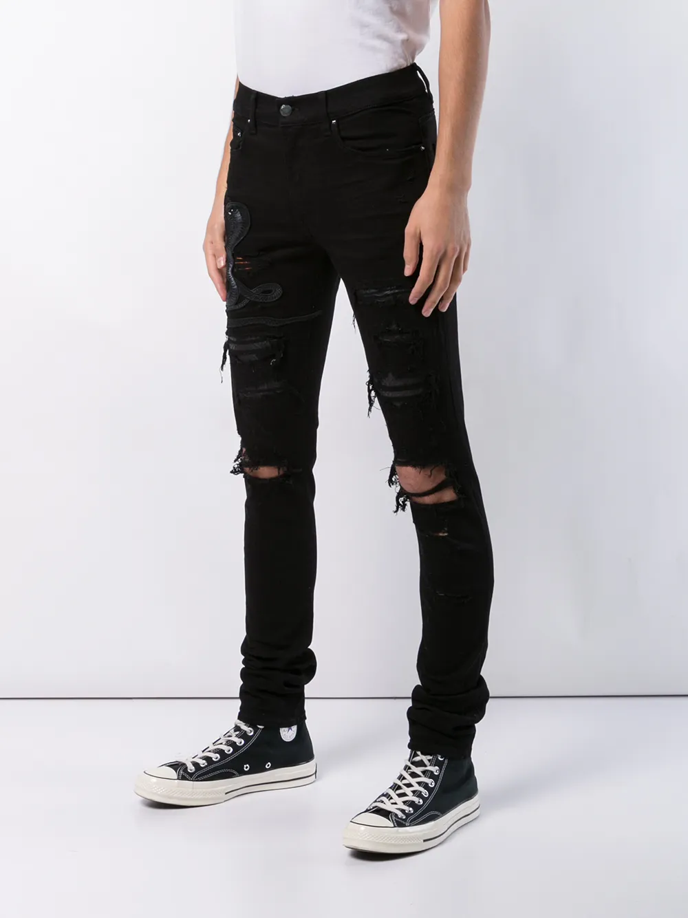 black amiri jeans with snake