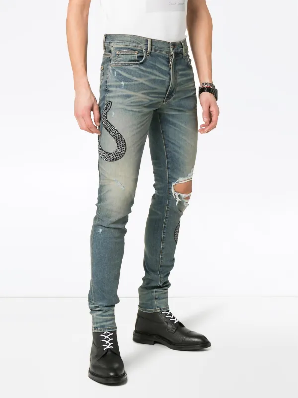 jeans with snakes on them