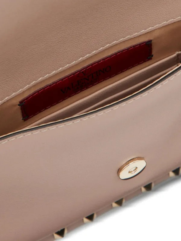 Valentino Garavani Rockstud Leather Clutch Bag | Pink | FARFETCH
