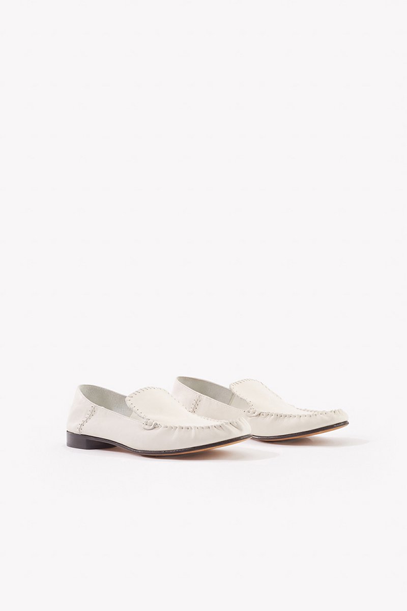 Nadia Moccasin-neutrals #1 Nadia Moccasin, Nadia flat moccasins from 3.1 Phillip Lim featuring ivory white, leather, whipstitch detailing, tonal design, round toe, slip-on style, branded leather insole and flat leather sole.
- 1