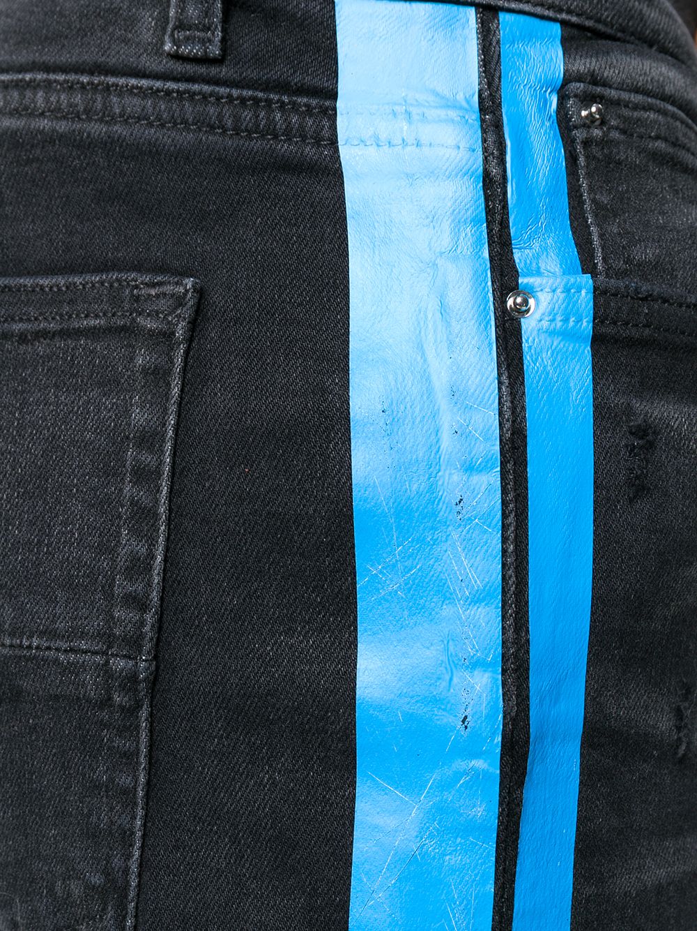 amiri jeans with white stripe