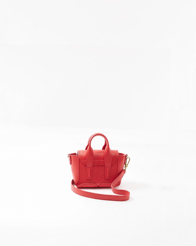 Pashli Nano Satchel-red #1 Pashli Nano Satchel, Red Calf Leather Pashli nano satchel from 3.1 Phillip Lim featuring two rounded top handles, adjustable detachable shoulder strap, gold-tone clasp fastening, main compartment, internal card slots and zip details.- 1