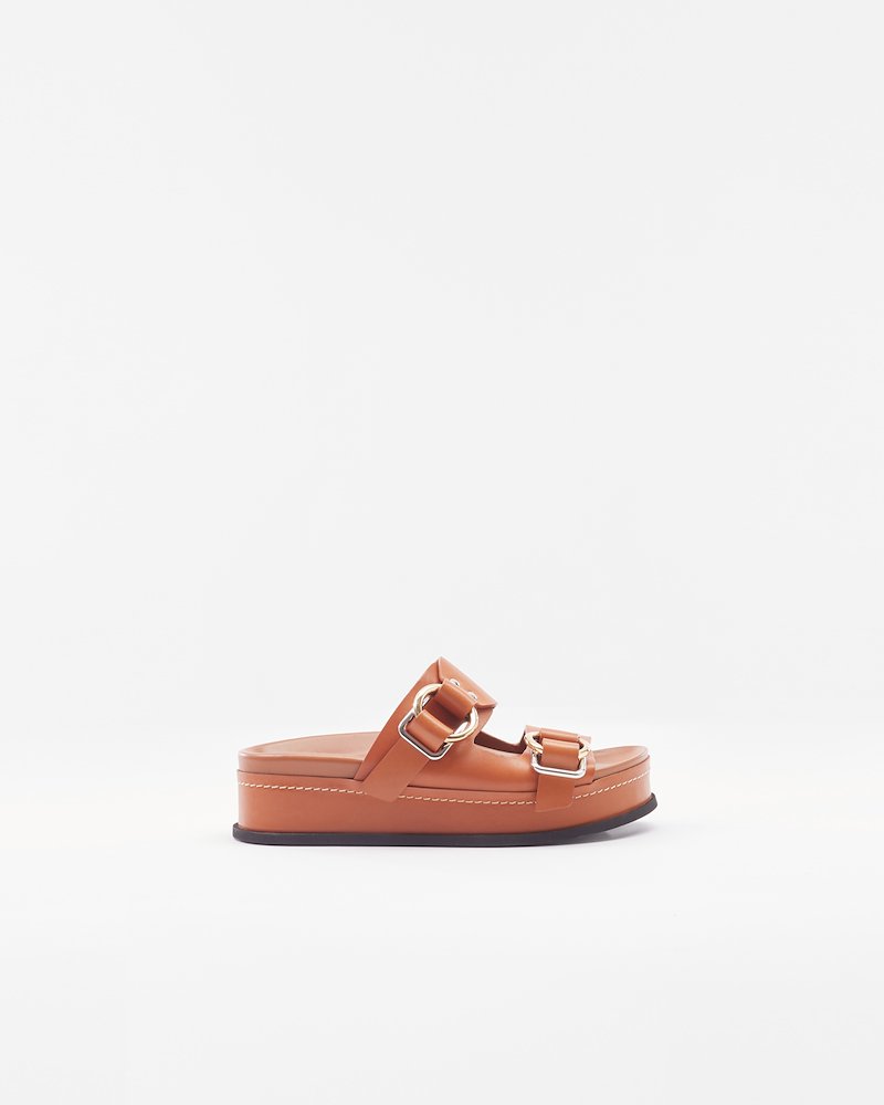 Freida Double-Buckle Platform Slide-brown #0 Freida Double-Buckle Platform Slide, Cognac brown calf leather Freida double-buckle platform slides from 3.1 Phillip Lim featuring open toe, slip-on style, branded insole, buckle fastening and flatform sole.- 0