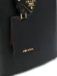 Prada حقيبة عملية ببروش الشعار