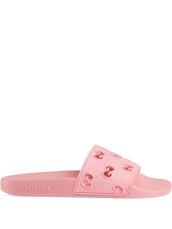 Shop pink Gucci rubber GG slide sandals 