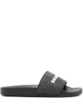 Balenciaga logo-embossed pool slides - Black