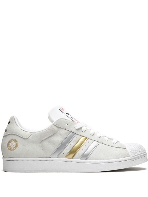 Shop white adidas Superstar 1 sneakers 