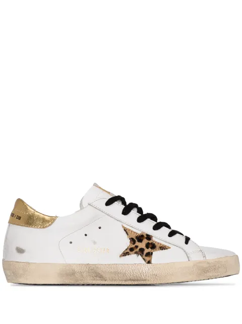 Click to view more detailed imagery on our partner's website Golden Goose Superstar Sneakers In White And Gold Leather With Leopard Printed Star In White Leather, Gold & Leopard