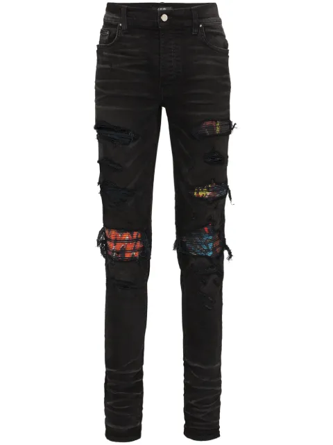 AMIRI MX1 patch distressed slim-leg jeans