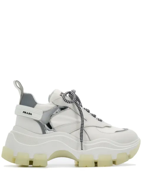 Click to view more detailed imagery on our partner's website Prada Pegasus Metallic-Paneled Leather And Canvas Sneakers In White