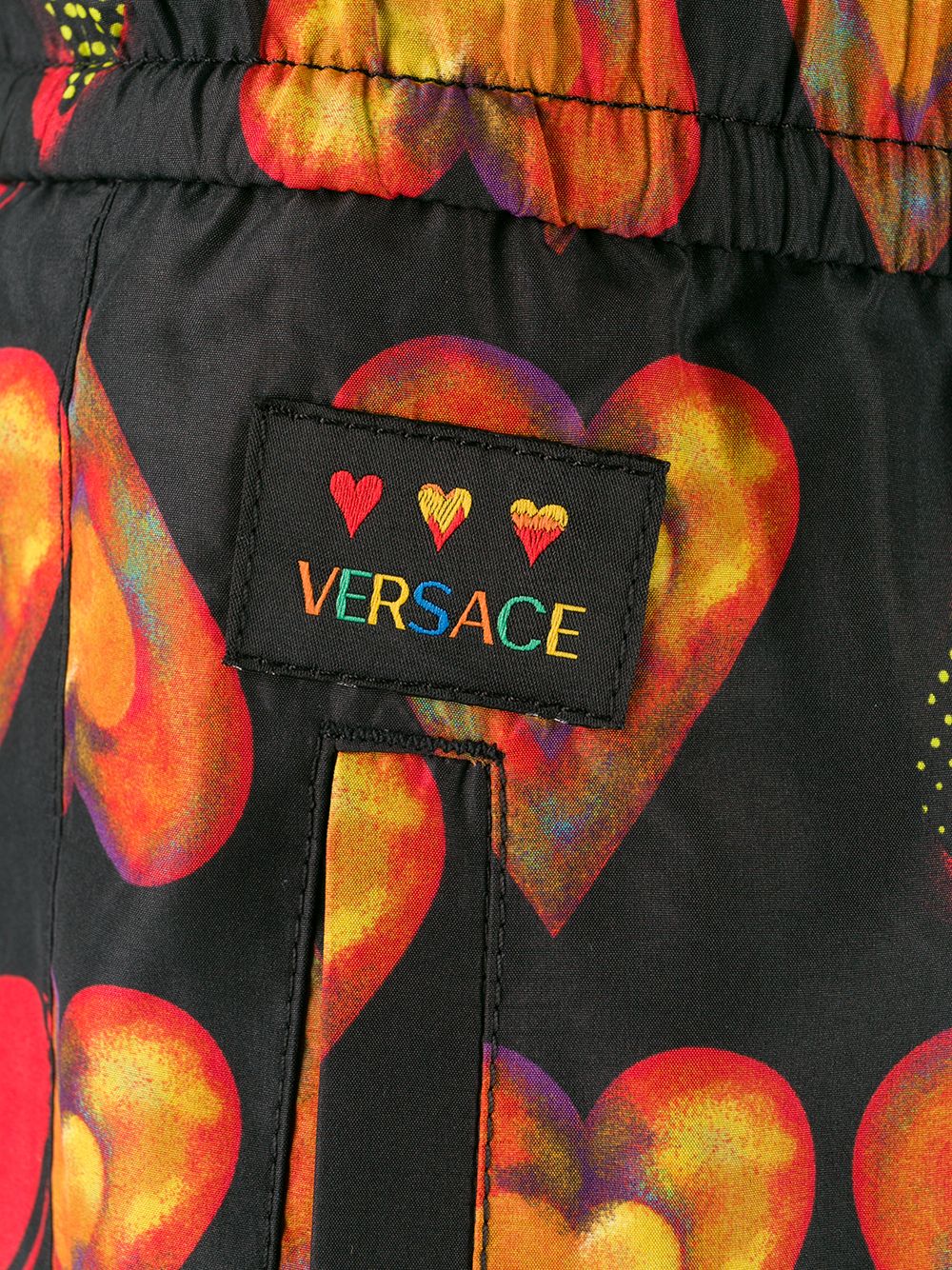 фото Versace джоггеры с принтом