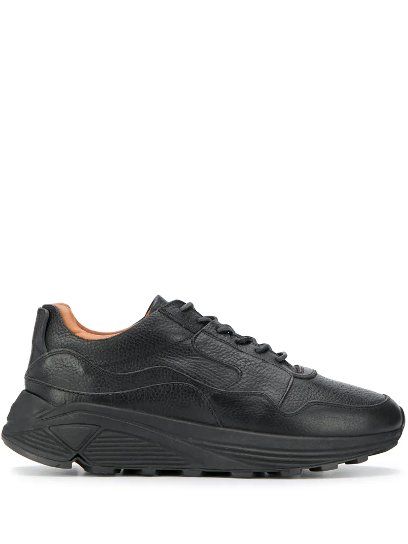 Click to view more detailed imagery on our partner's website Buttero Low Top Wedge Sole Sneakers In Black