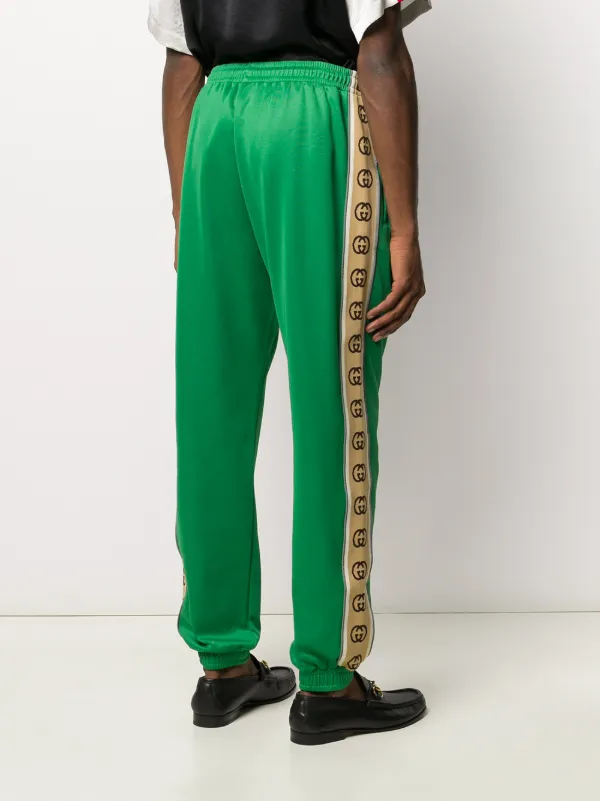 green tape logo track pants