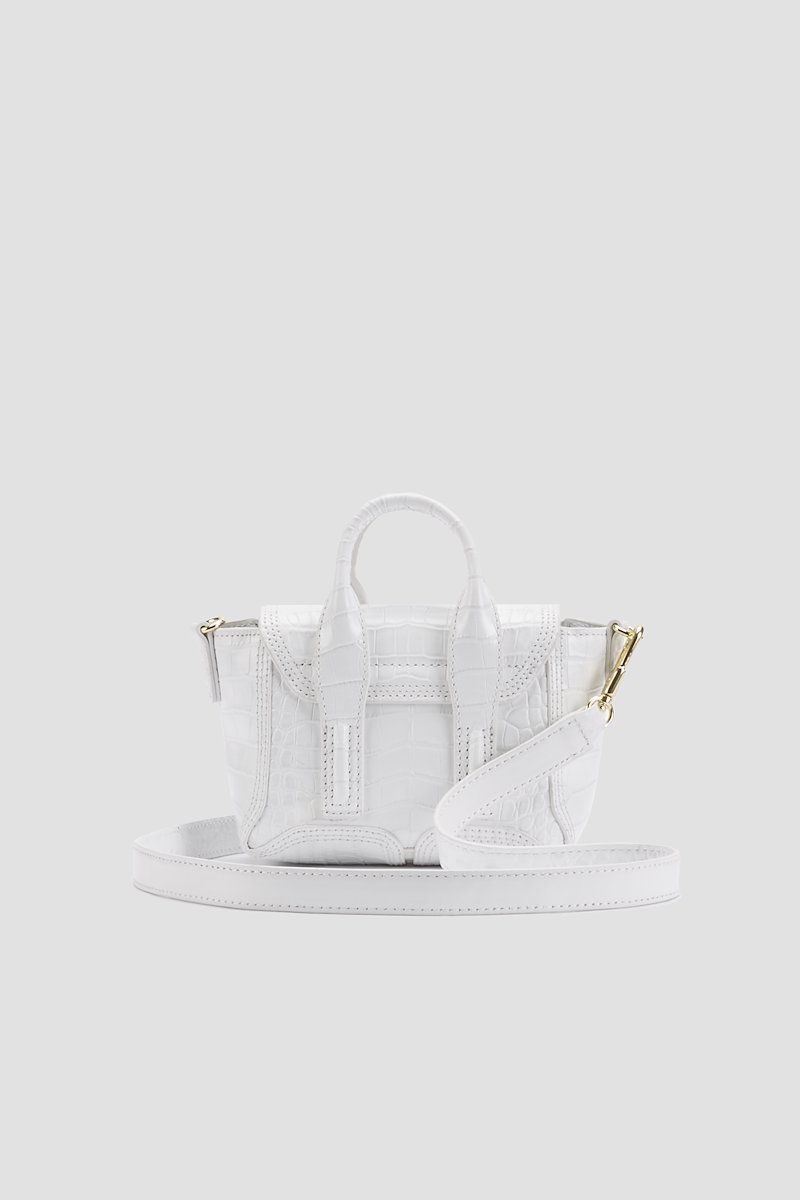 Pashli Nano Satchel-white #0 Pashli Nano Satchel, Need more proof that the best gifts in life come in the smallest of packages? This Pashli Nano crossbody bag from 3.1 Phillip Lim might just be what Shakespeare had in mind when he wrote: "though she be but little, she is fierce." It packs a punch - and your favourite lipstick. Featuring an embossed crocodile effect, gold-tone hardware, a chain and leather strap, a foldover top with magnetic closure and internal slip pockets.- 2