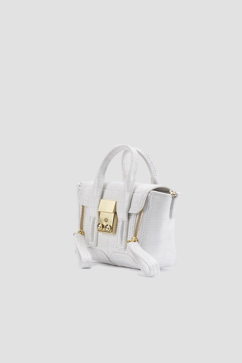 Pashli Nano Satchel-white #1 Pashli Nano Satchel, Need more proof that the best gifts in life come in the smallest of packages? This Pashli Nano crossbody bag from 3.1 Phillip Lim might just be what Shakespeare had in mind when he wrote: "though she be but little, she is fierce." It packs a punch - and your favourite lipstick. Featuring an embossed crocodile effect, gold-tone hardware, a chain and leather strap, a foldover top with magnetic closure and internal slip pockets.- 1