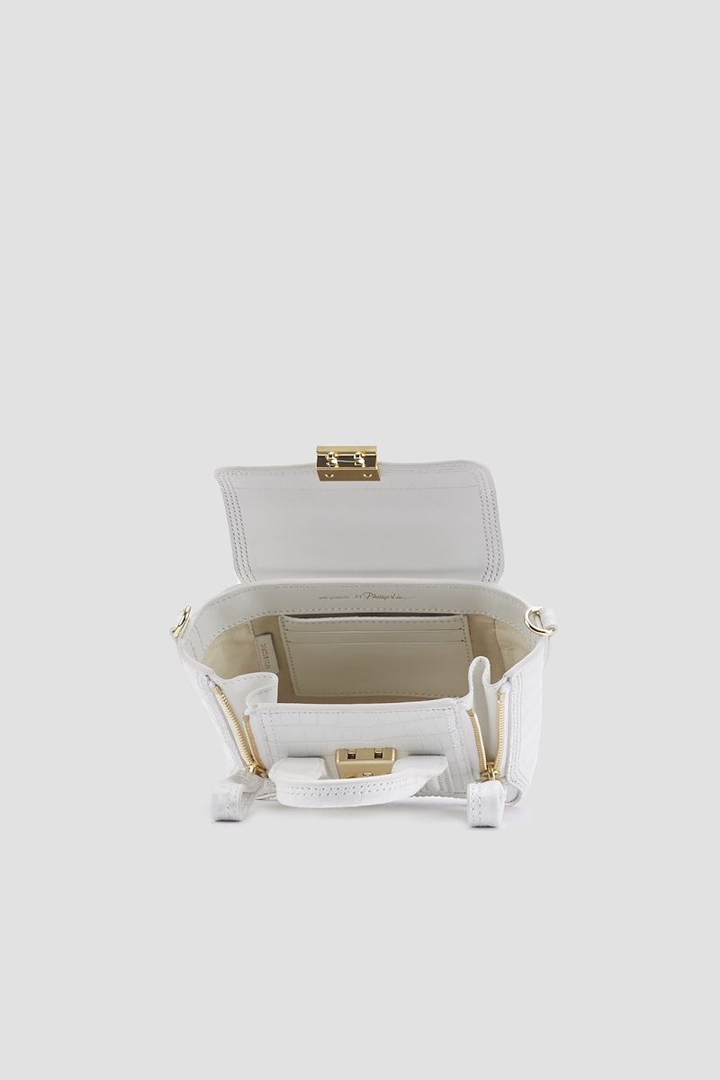 Pashli Nano Satchel-white #1 Pashli Nano Satchel, Need more proof that the best gifts in life come in the smallest of packages? This Pashli Nano crossbody bag from 3.1 Phillip Lim might just be what Shakespeare had in mind when he wrote: "though she be but little, she is fierce." It packs a punch - and your favourite lipstick. Featuring an embossed crocodile effect, gold-tone hardware, a chain and leather strap, a foldover top with magnetic closure and internal slip pockets.- 3