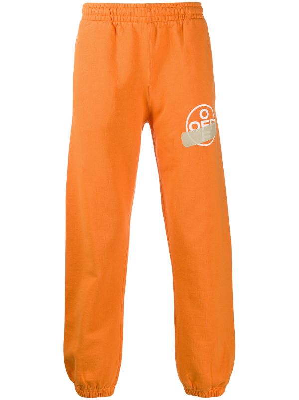 orange and white track pants