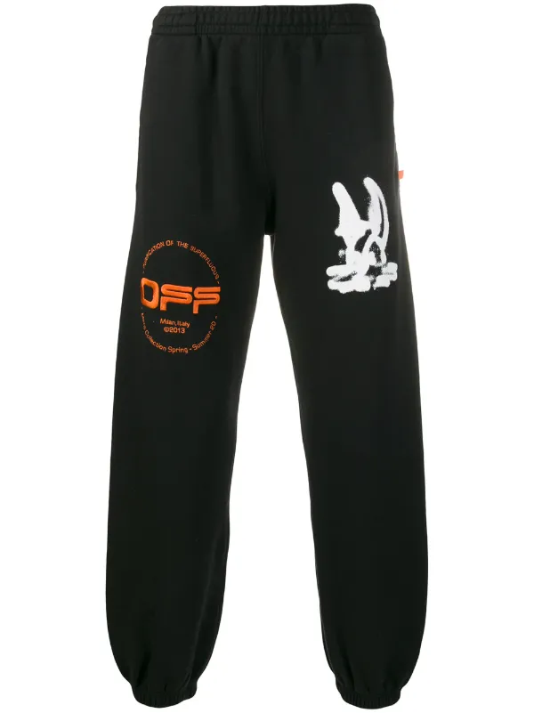 white and orange track pants