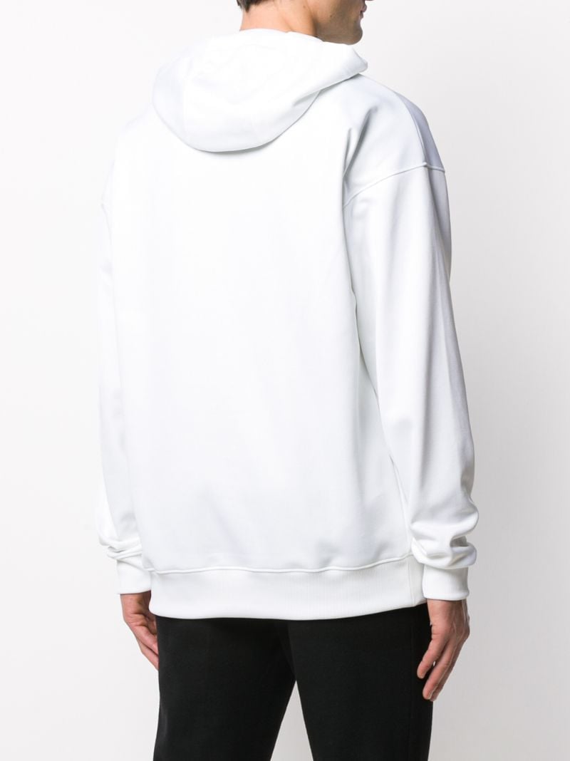 Shop Moschino Logo Hoodie In White