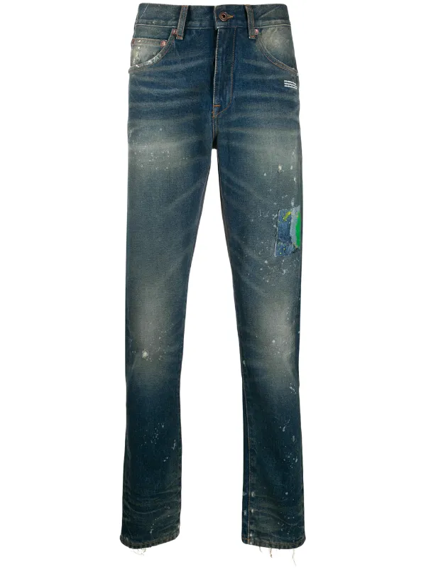 blue jeans with white paint splatter