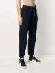 Thom Browne بنطال رياضي بقصة مستقيمة مزين بأربعة خطوط