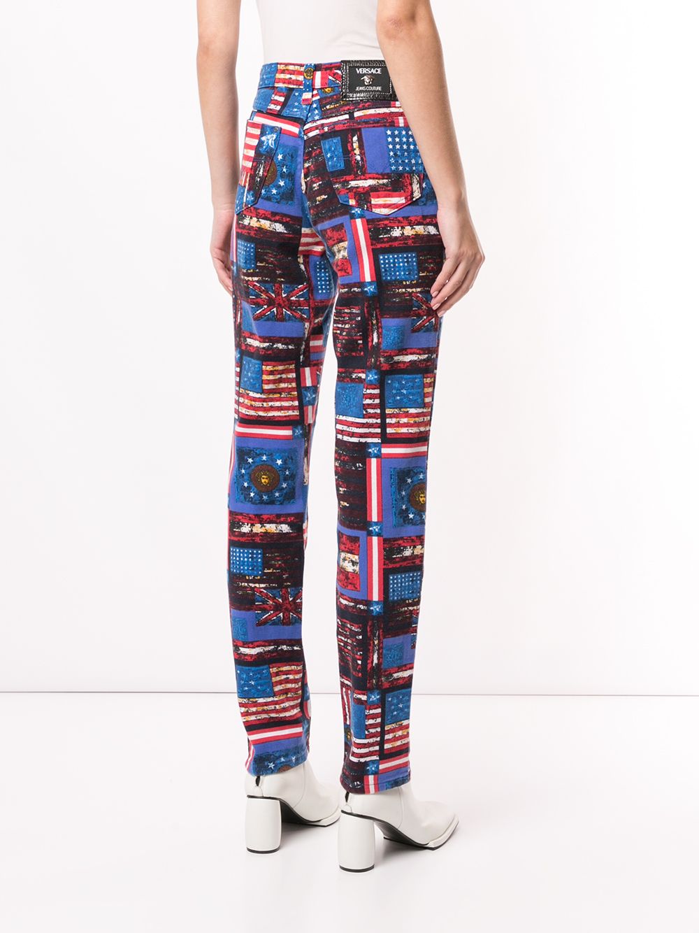 Shop blue & red Versace Pre-Owned flag print straight-leg jeans with ...