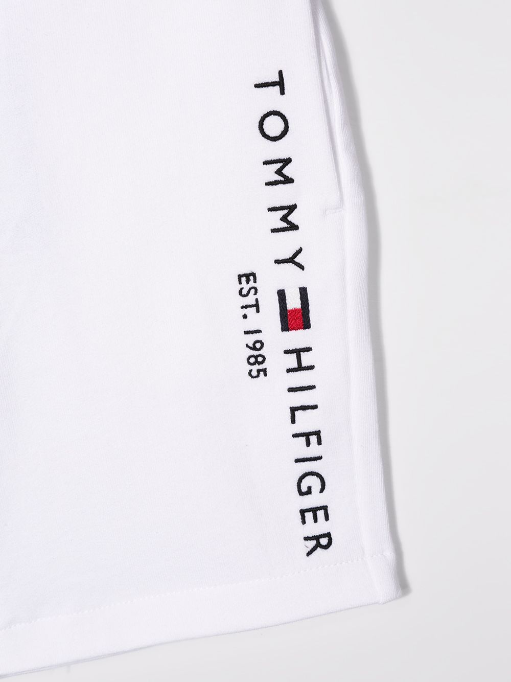 Shop Tommy Hilfiger Junior Logo Track Pants In White
