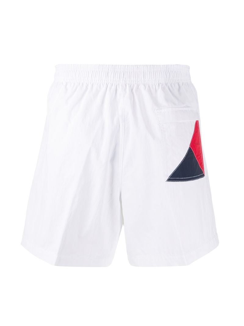 Shop Tommy Hilfiger Logo Print Swim Shorts In White