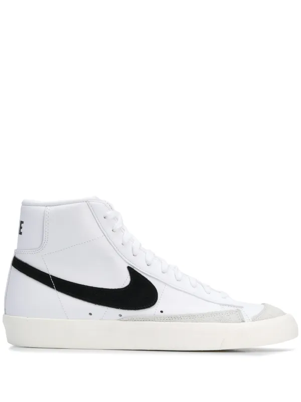 white nike high tops with black swoosh