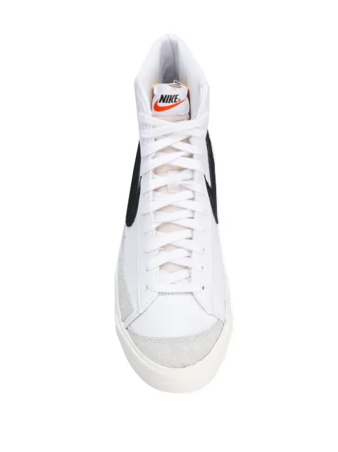 white nike high tops with black swoosh