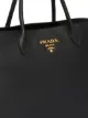 Prada حقيبة عملية ببروش شعار الماركة