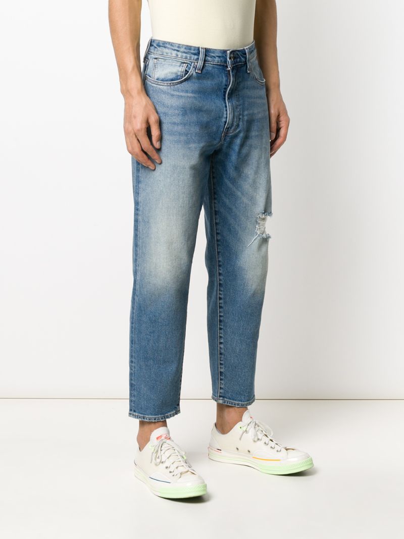 Shop Levi's Mid Rise Tapered Jeans In Blue