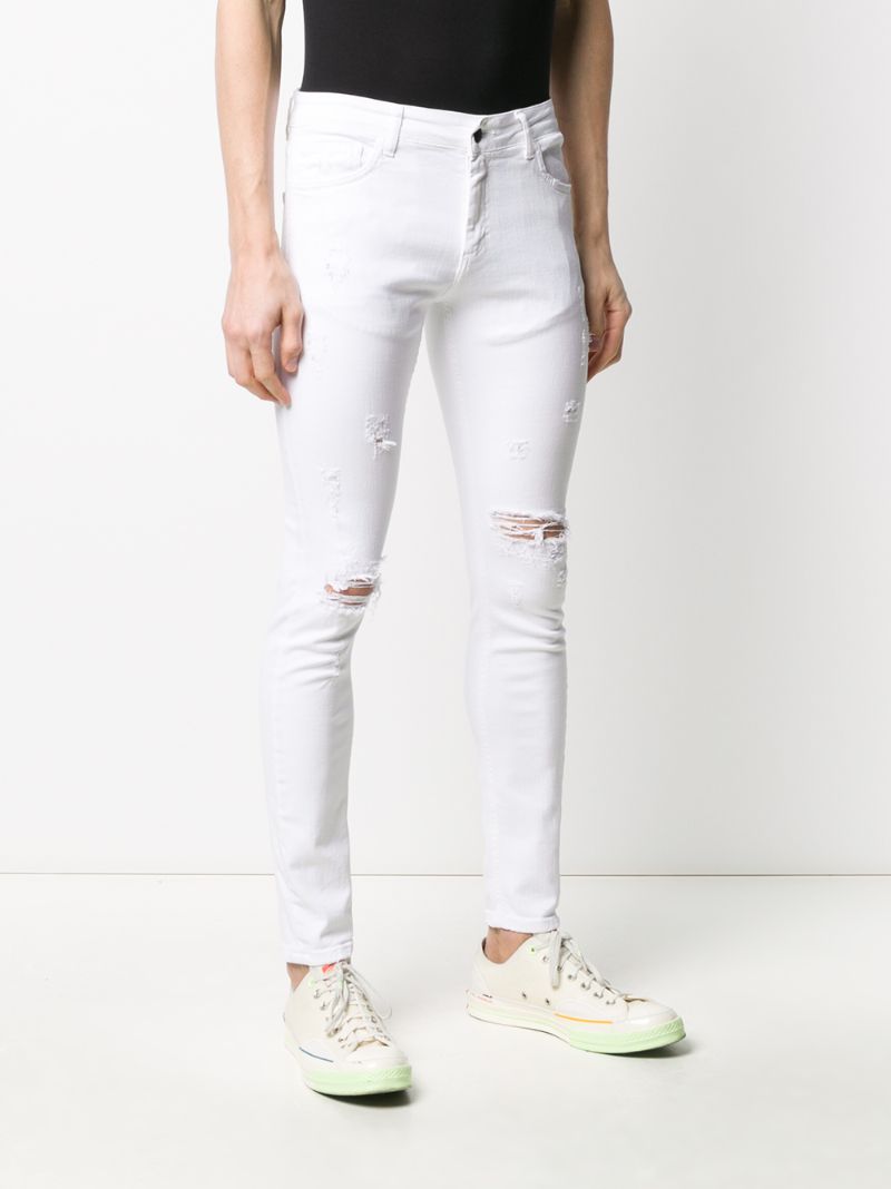 Shop Family First Distressed Skinny Jeans In White