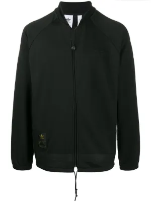 weiße adidas jacke mit goldenen streifen