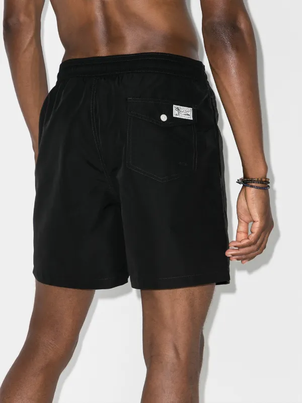 black polo and shorts