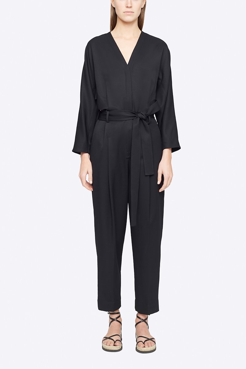Wool Belted Jumpsuit-black #0 Wool Belted Jumpsuit, Black wool tie-waist wool jumpsuit from 3.1 PHILLIP LIM featuring V-neck, three-quarter length sleeves, buttoned cuffs, tied waist, concealed front button fastening, two side slit pockets, pleat detailing and tapered leg.- 0