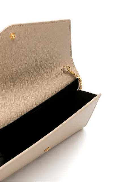 Shop Saint Laurent Uptown envelope leather clutch bag with Express ...